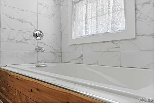 bathroom with a bath and a shower