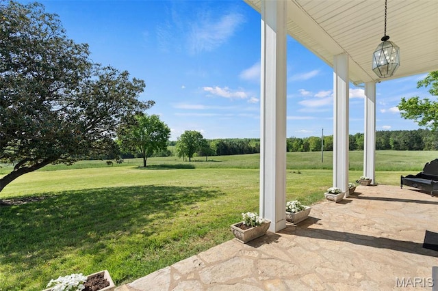 view of patio featuring a view of rural / pastoral area