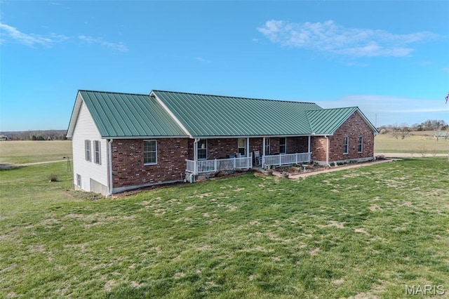 23598 Falcon Rd, Lebanon, MO 65536 - back of house with a porch, brick siding, and a yard