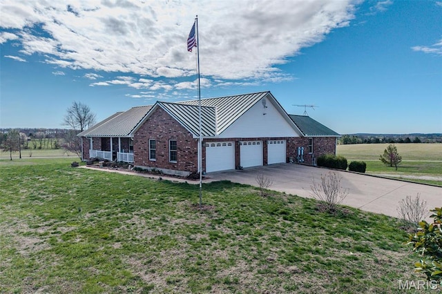 23598 Falcon Rd, Lebanon, MO 65536 - view of home's exterior with a garage, brick siding, concrete driveway, a lawn, and metal roof