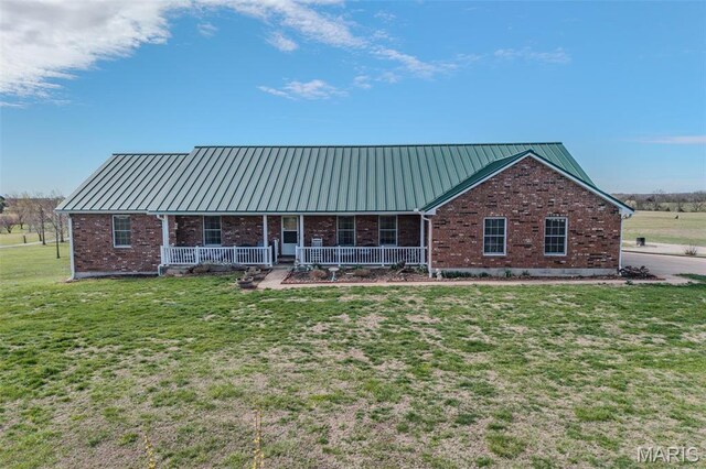 23598 Falcon Rd, Lebanon, MO 65536 - view of front of home with covered porch, a front yard, brick siding, and metal roof