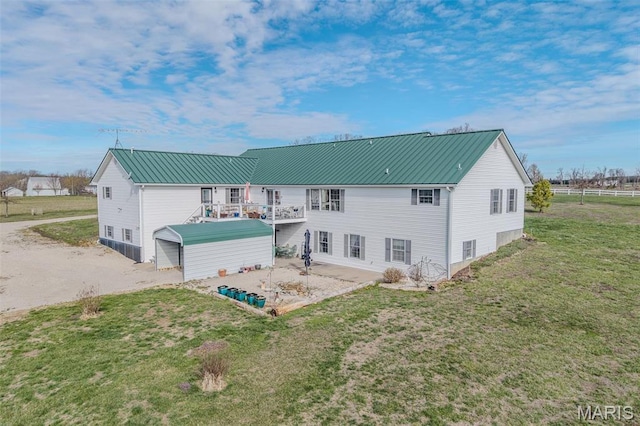 23598 Falcon Rd, Lebanon, MO 65536 - rear view of house featuring a yard and metal roof