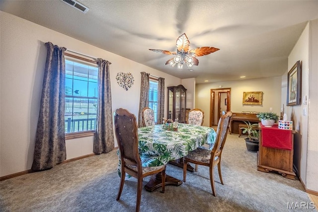 23598 Falcon Rd, Lebanon, MO 65536 - carpeted dining area featuring a ceiling fan and baseboards