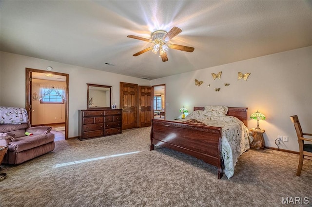 23598 Falcon Rd, Lebanon, MO 65536 - carpeted bedroom with multiple windows, baseboards, and a ceiling fan