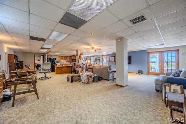 23598 Falcon Rd, Lebanon, MO 65536 - living area featuring light carpet, a paneled ceiling, and ceiling fan