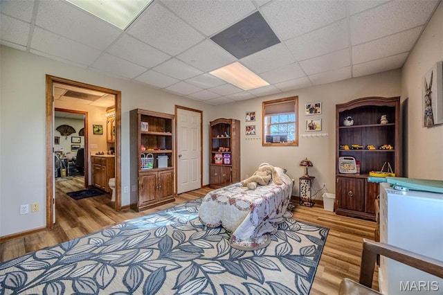 23598 Falcon Rd, Lebanon, MO 65536 - sitting room featuring light wood-style floors, a drop ceiling, and baseboards
