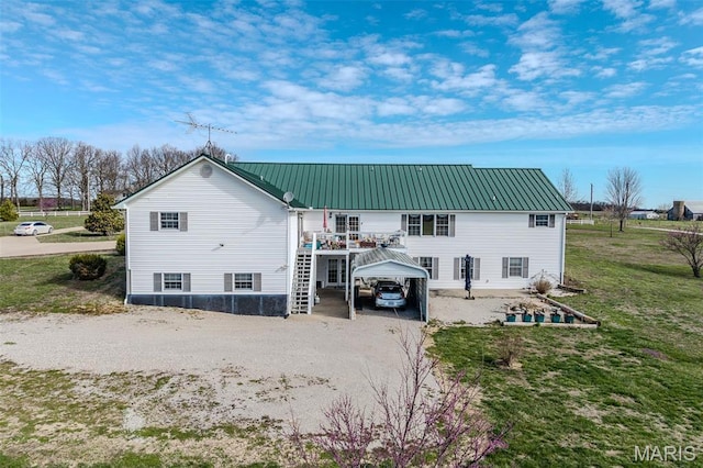 23598 Falcon Rd, Lebanon, MO 65536 - back of house featuring a detached carport, dirt driveway, metal roof, stairway, and a wooden deck