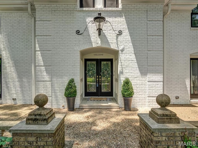 335 N Powder Mill Rd, Belleville, IL 62223 - doorway to property featuring french doors and brick siding