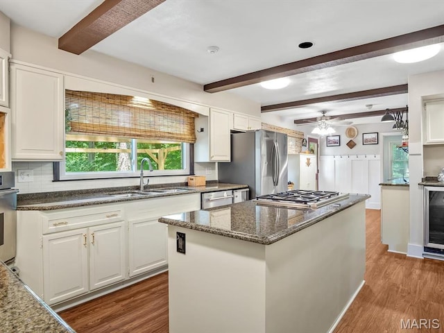 335 N Powder Mill Rd, Belleville, IL 62223 - kitchen with beam ceiling, appliances with stainless steel finishes, wood finished floors, and white cabinets