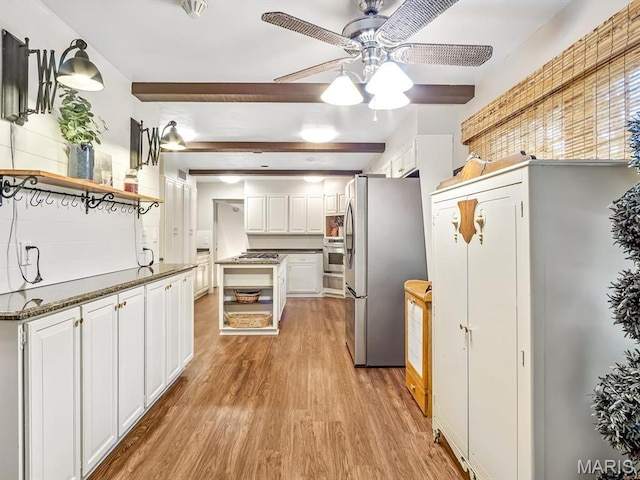 335 N Powder Mill Rd, Belleville, IL 62223 - kitchen with open shelves, appliances with stainless steel finishes, ceiling fan, light wood-style floors, and white cabinetry