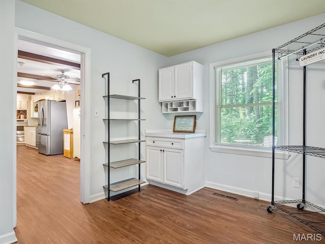 335 N Powder Mill Rd, Belleville, IL 62223 - kitchen featuring freestanding refrigerator, wood finished floors, white cabinets, and light countertops