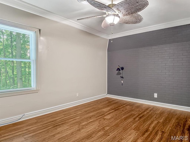 335 N Powder Mill Rd, Belleville, IL 62223 - empty room featuring brick wall, healthy amount of natural light, wood finished floors, crown molding, and a ceiling fan