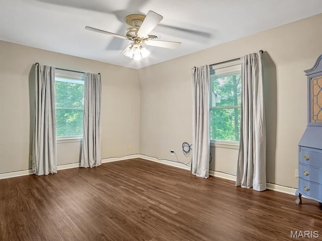 335 N Powder Mill Rd, Belleville, IL 62223 - unfurnished room with dark wood finished floors, healthy amount of natural light, and a ceiling fan