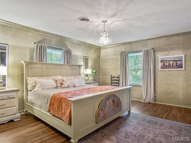 335 N Powder Mill Rd, Belleville, IL 62223 - bedroom featuring wood finished floors, a chandelier, crown molding, multiple windows, and wallpapered walls