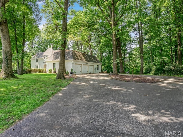 335 N Powder Mill Rd, Belleville, IL 62223 - view of front facade featuring asphalt driveway and a front yard