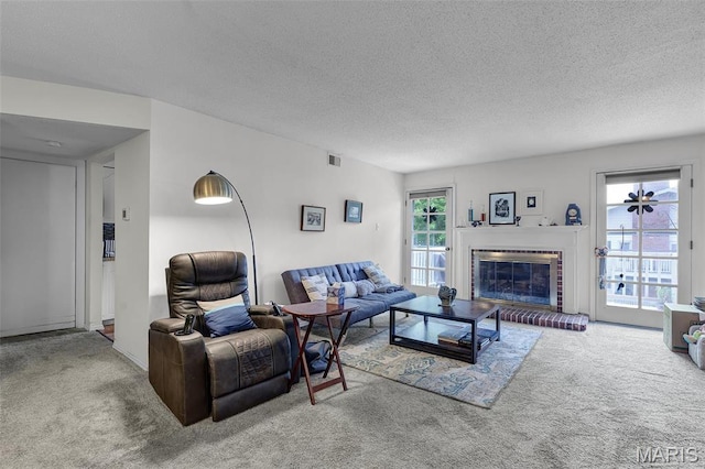 1511 Hampton Hall Dr Unit 22, Chesterfield, MO 63017 - living area featuring carpet, a textured ceiling, and a brick fireplace