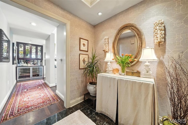 hallway with baseboards and recessed lighting