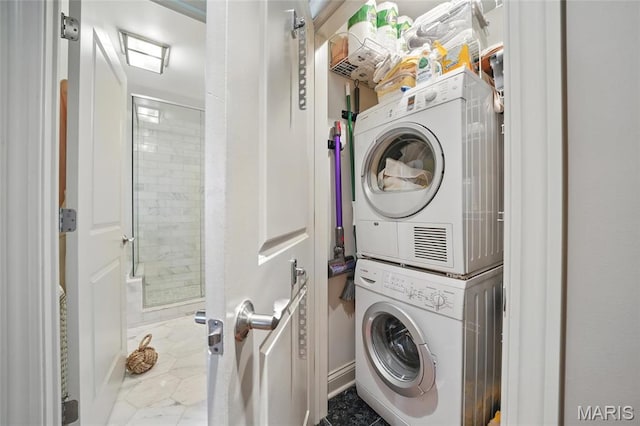 washroom with estacked washer and dryer