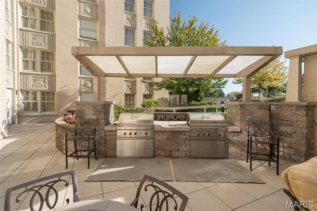 view of patio / terrace featuring an outdoor kitchen and area for grilling