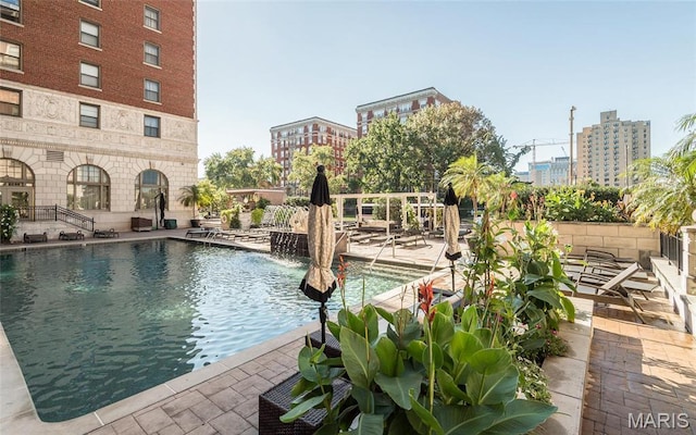 community pool featuring a patio area