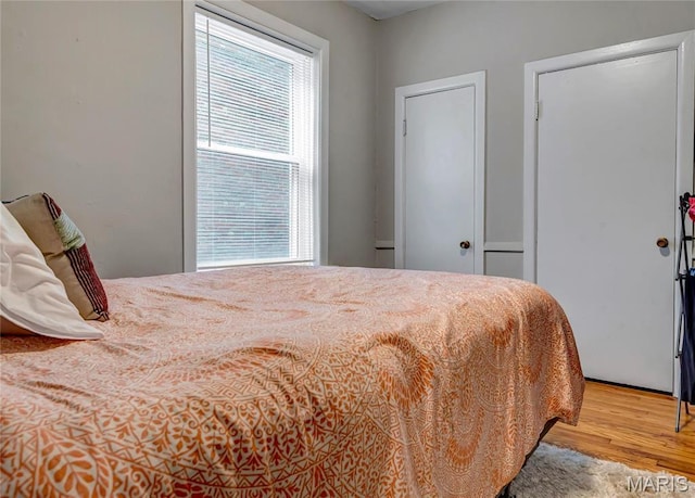 bedroom with wood finished floors