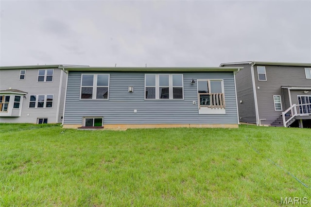 back of property with a yard