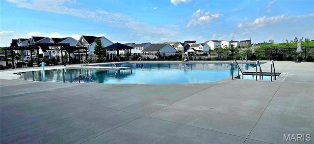 327 Dalriada Blvd, Ofallon, MO 63368 - community pool with fence, a residential view, and a patio area