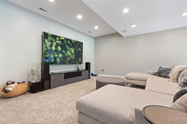 cinema with carpet floors and recessed lighting
