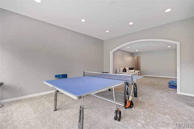 game room featuring arched walkways, recessed lighting, carpet floors, and baseboards