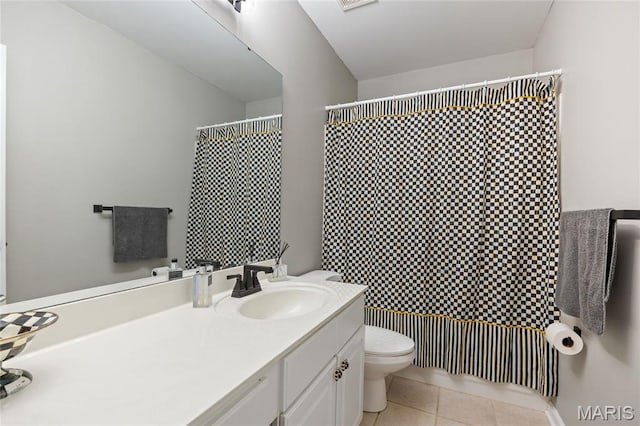 bathroom featuring tile patterned flooring, toilet, vanity, and a shower with curtain