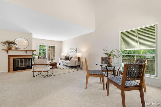 8704 Garden Ct, Brentwood, MO 63144 - dining space with carpet and a tile fireplace