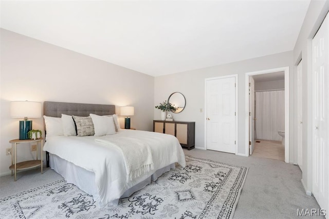 8704 Garden Ct, Brentwood, MO 63144 - carpeted bedroom featuring baseboards and connected bathroom
