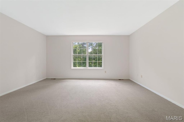 8704 Garden Ct, Brentwood, MO 63144 - carpeted empty room featuring baseboards