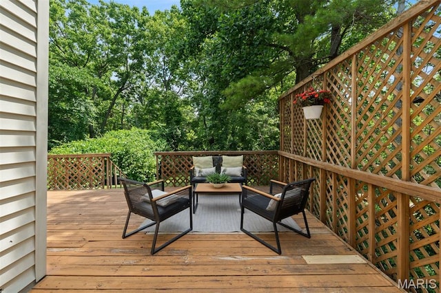8704 Garden Ct, Brentwood, MO 63144 - wooden deck featuring an outdoor hangout area