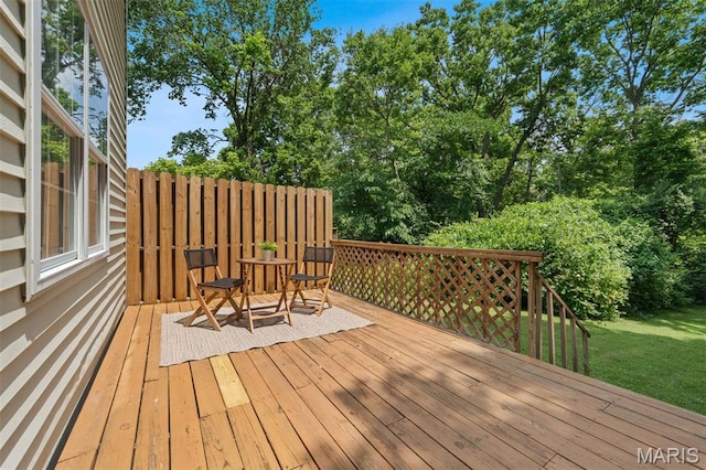 8704 Garden Ct, Brentwood, MO 63144 - wooden terrace with a lawn