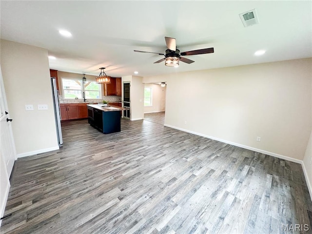 800 E Center St, Salem, MO 65560 - unfurnished living room featuring a ceiling fan, dark wood-style flooring, recessed lighting, and baseboards