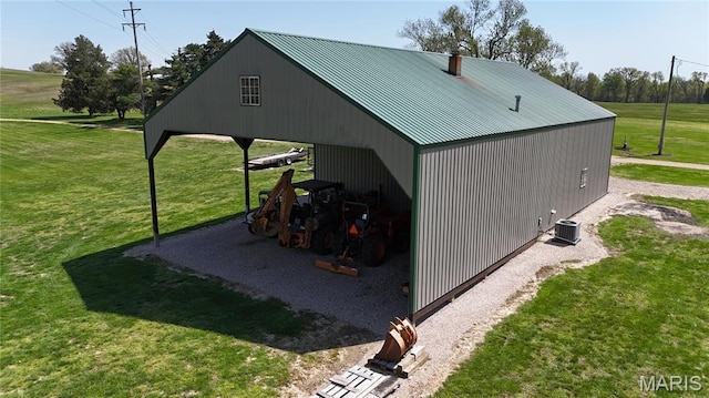 12503 County Road 292, Bloomfield, MO 63825 - view of pole building featuring a lawn, central air condition unit, and a carport