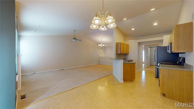 kitchen with a chandelier, open floor plan, lofted ceiling, baseboards, and light floors