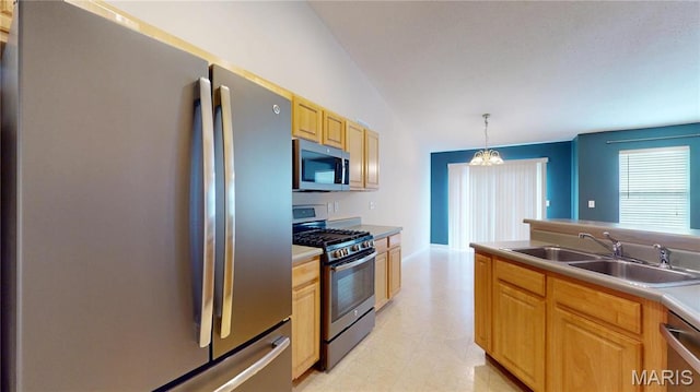 kitchen featuring stainless steel appliances, a sink, a chandelier, light flooring, and vaulted ceiling