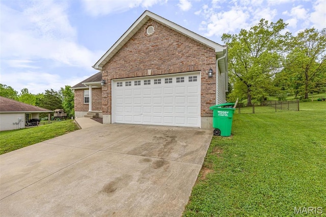 1824 Oak Knl, Farmington, MO 63640 - view of front of property with a front yard, concrete driveway, brick siding, and a garage