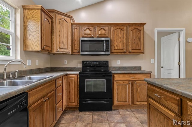 1824 Oak Knl, Farmington, MO 63640 - kitchen featuring black appliances, a sink, brown cabinetry, and lofted ceiling