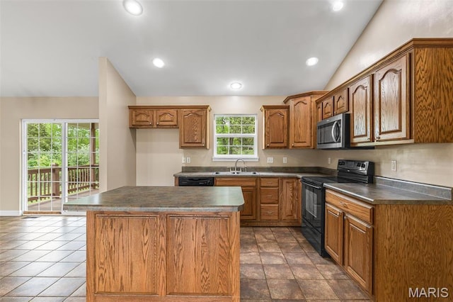 1824 Oak Knl, Farmington, MO 63640 - kitchen featuring black appliances, brown cabinetry, dark countertops, a center island, and vaulted ceiling