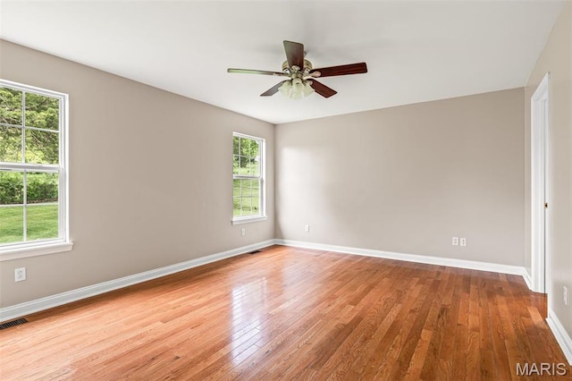 1824 Oak Knl, Farmington, MO 63640 - spare room featuring wood finished floors, baseboards, and ceiling fan