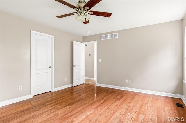 1824 Oak Knl, Farmington, MO 63640 - unfurnished bedroom with baseboards, light wood-type flooring, and a ceiling fan