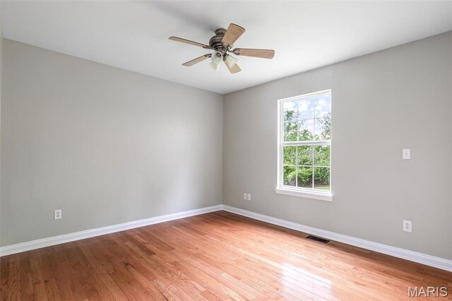 1824 Oak Knl, Farmington, MO 63640 - unfurnished room featuring baseboards, wood finished floors, and a ceiling fan