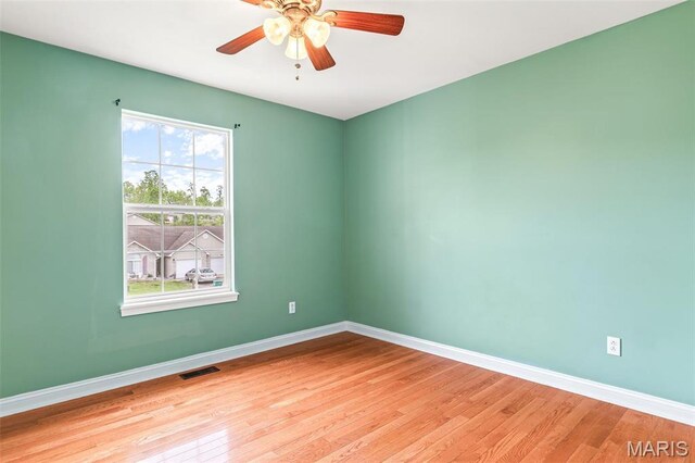1824 Oak Knl, Farmington, MO 63640 - unfurnished room with light wood finished floors, baseboards, and a ceiling fan