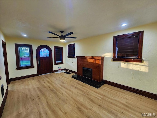 436 Hern Ave, Saint Louis, MO 63135 - unfurnished living room with baseboards, light wood-type flooring, ceiling fan, a fireplace, and recessed lighting