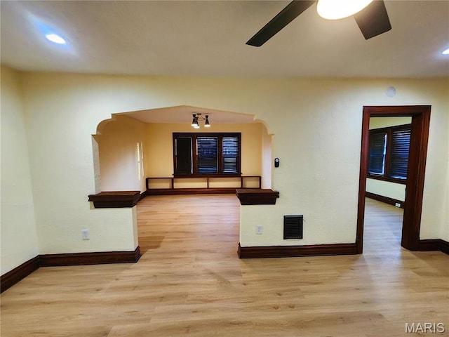 436 Hern Ave, Saint Louis, MO 63135 - unfurnished room with ceiling fan, baseboards, wood finished floors, recessed lighting, and arched walkways