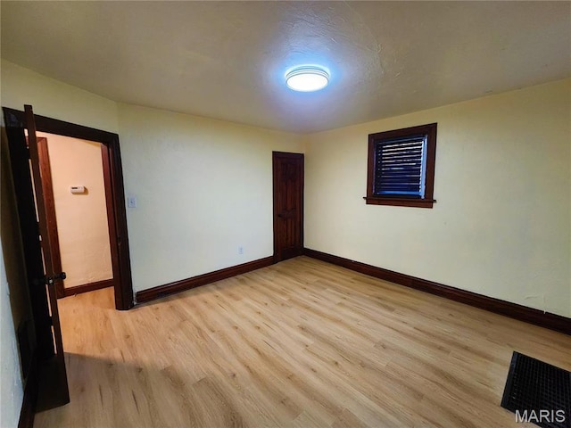 436 Hern Ave, Saint Louis, MO 63135 - unfurnished room featuring light wood-style floors and baseboards