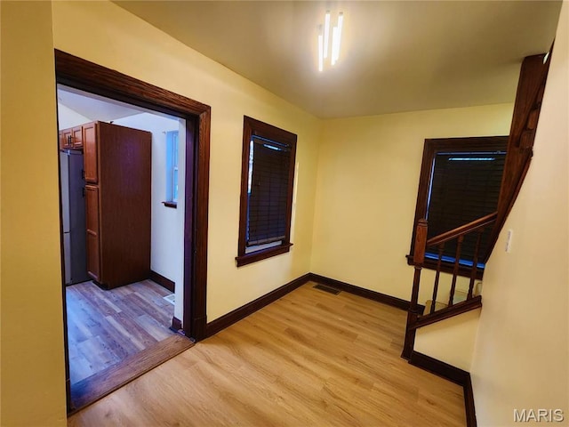 436 Hern Ave, Saint Louis, MO 63135 - hall with light wood finished floors, baseboards, and stairs